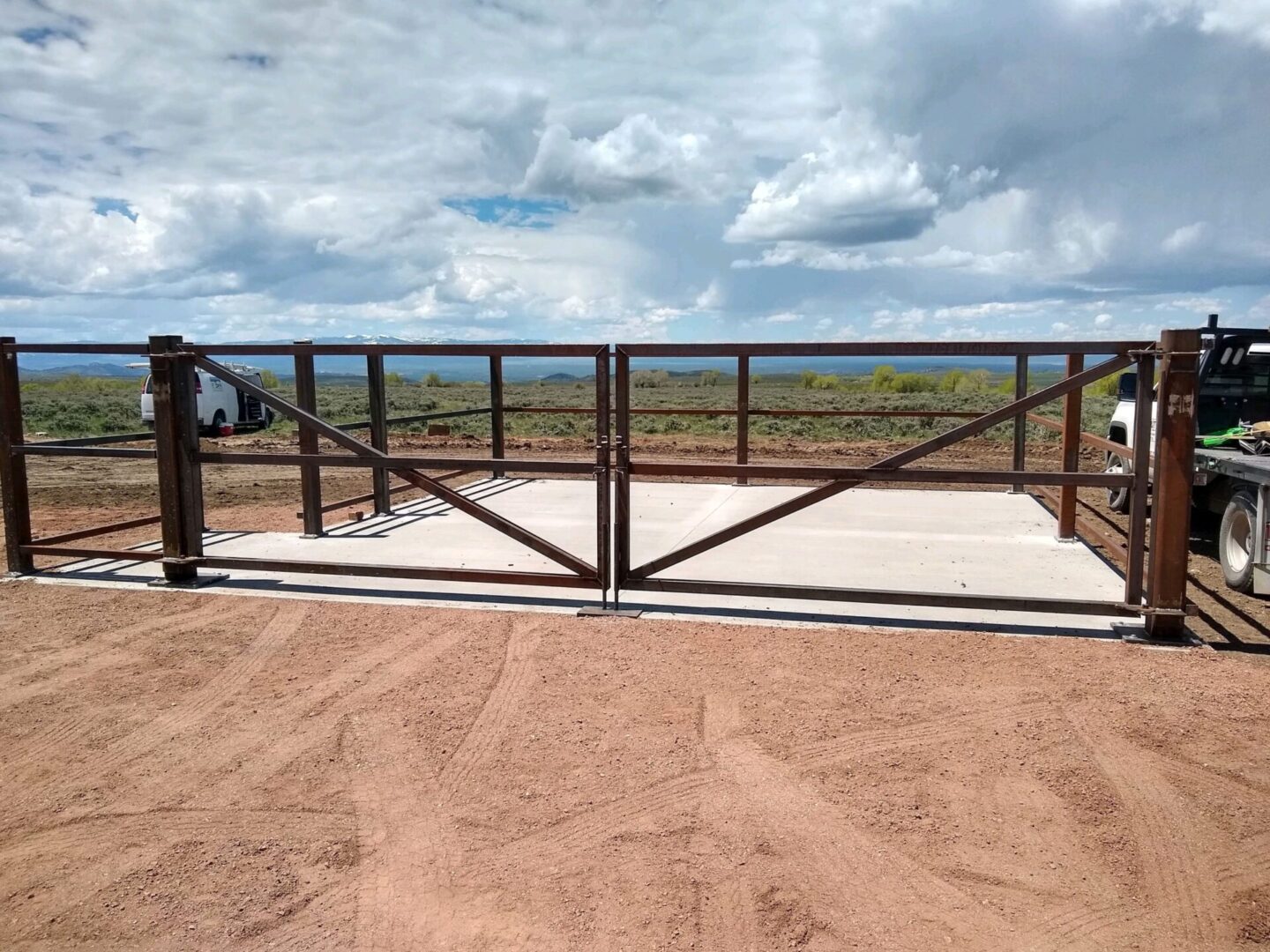 A metal gate with a sky background