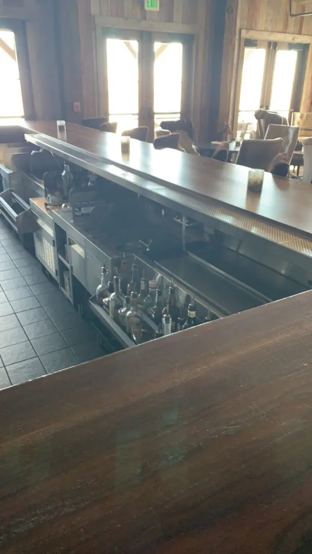 A restaurant kitchen with many metal cabinets and tables.